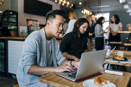 person using a laptop to create html mailto